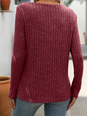 Burgundy ribbed knit henley top with long sleeves and a keyhole neckline.