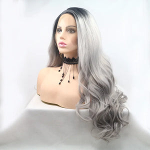 Voluminous lace front wig in black and grey ombre with loose waves.