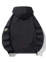Black hooded utility jacket with drawstring hem and patch detail on sleeve