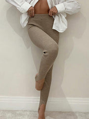 Camel ribbed knit stirrup leggings with a cut-out detail on the knee.