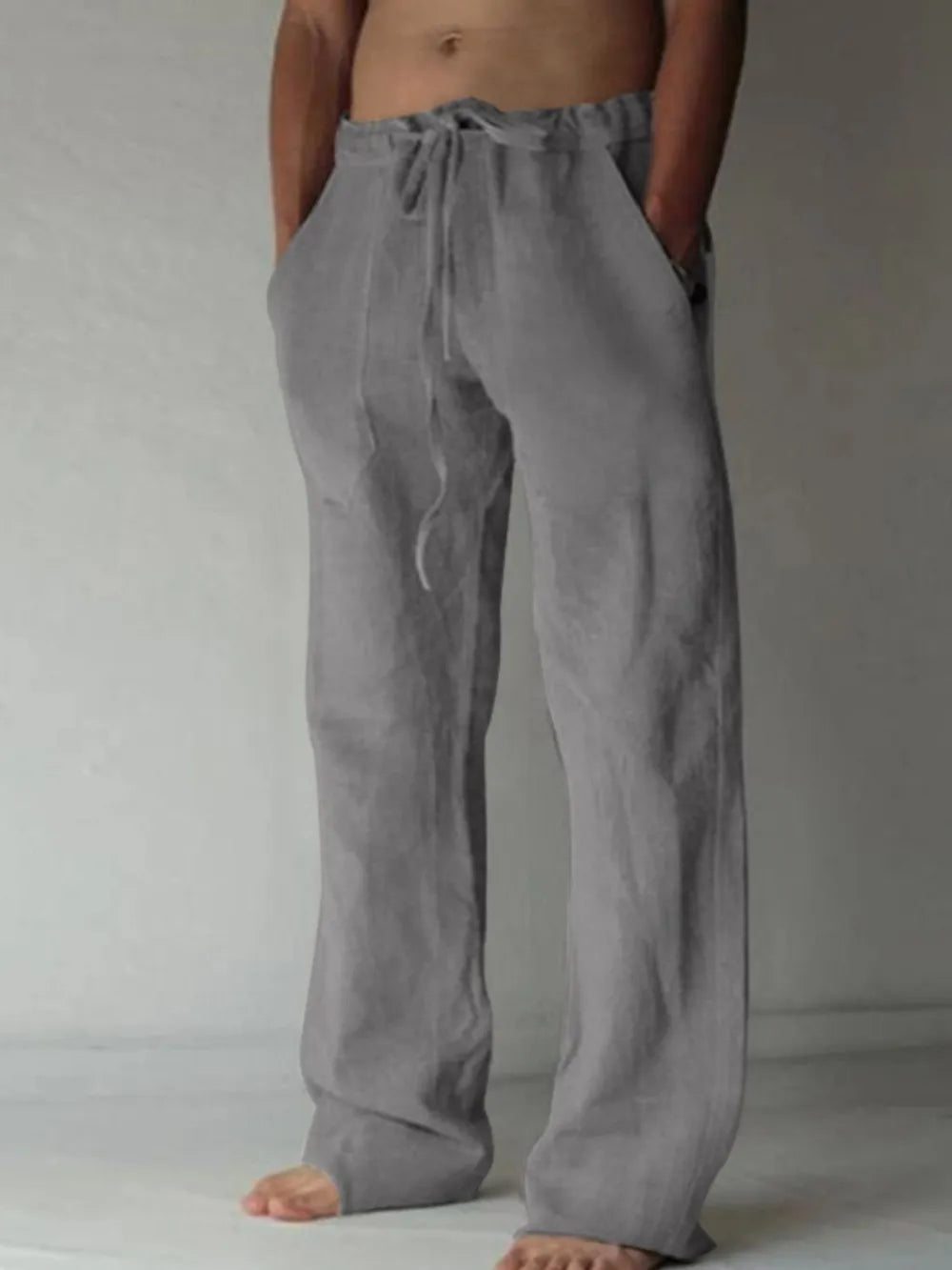 Gray linen blend wide-leg drawstring trousers with pockets.