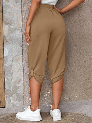 Camel cropped culottes with button detail at the hem.