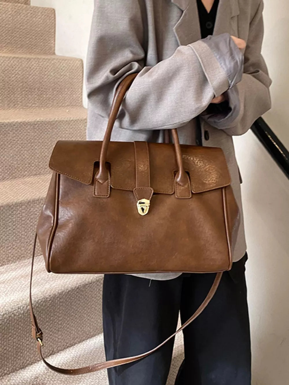 Dark brown pu leather tote bag with buckle detail and top handles