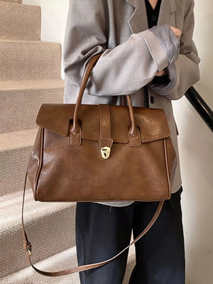 Dark brown pu leather tote bag with buckle detail and top handles