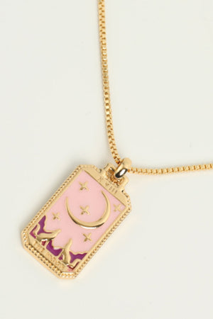 Celestial tarot pendant necklace set with moon and stars on pink enamel, gold chain