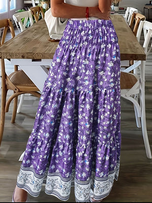 Purple floral maxi tiered skirt with a border print hem and smocked waist.