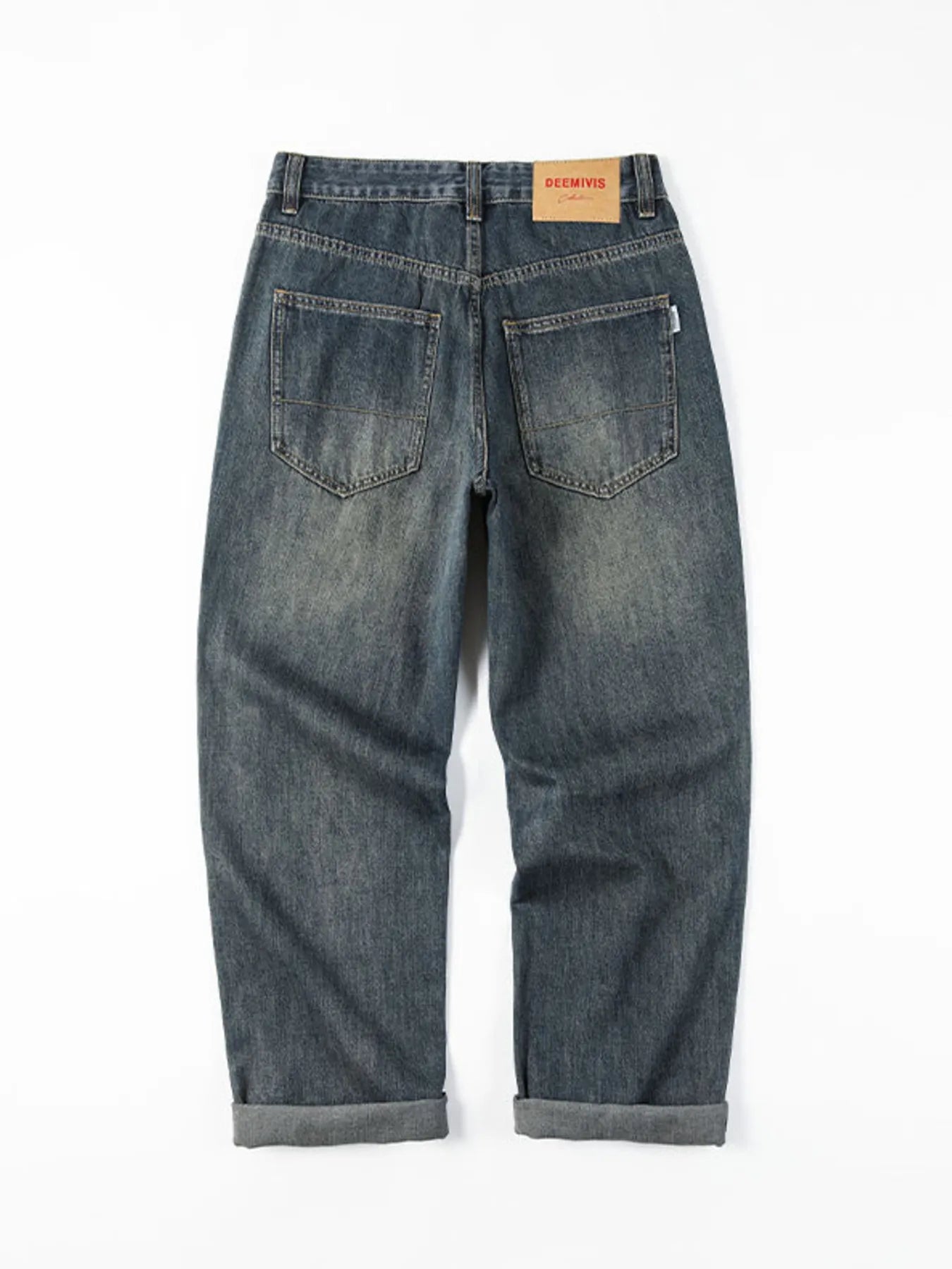 Vintage wash blue cotton denim loose fit jeans with a rolled hem.