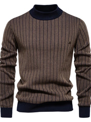 Brown ribbed stripe mock neck pullover sweater with navy trim.