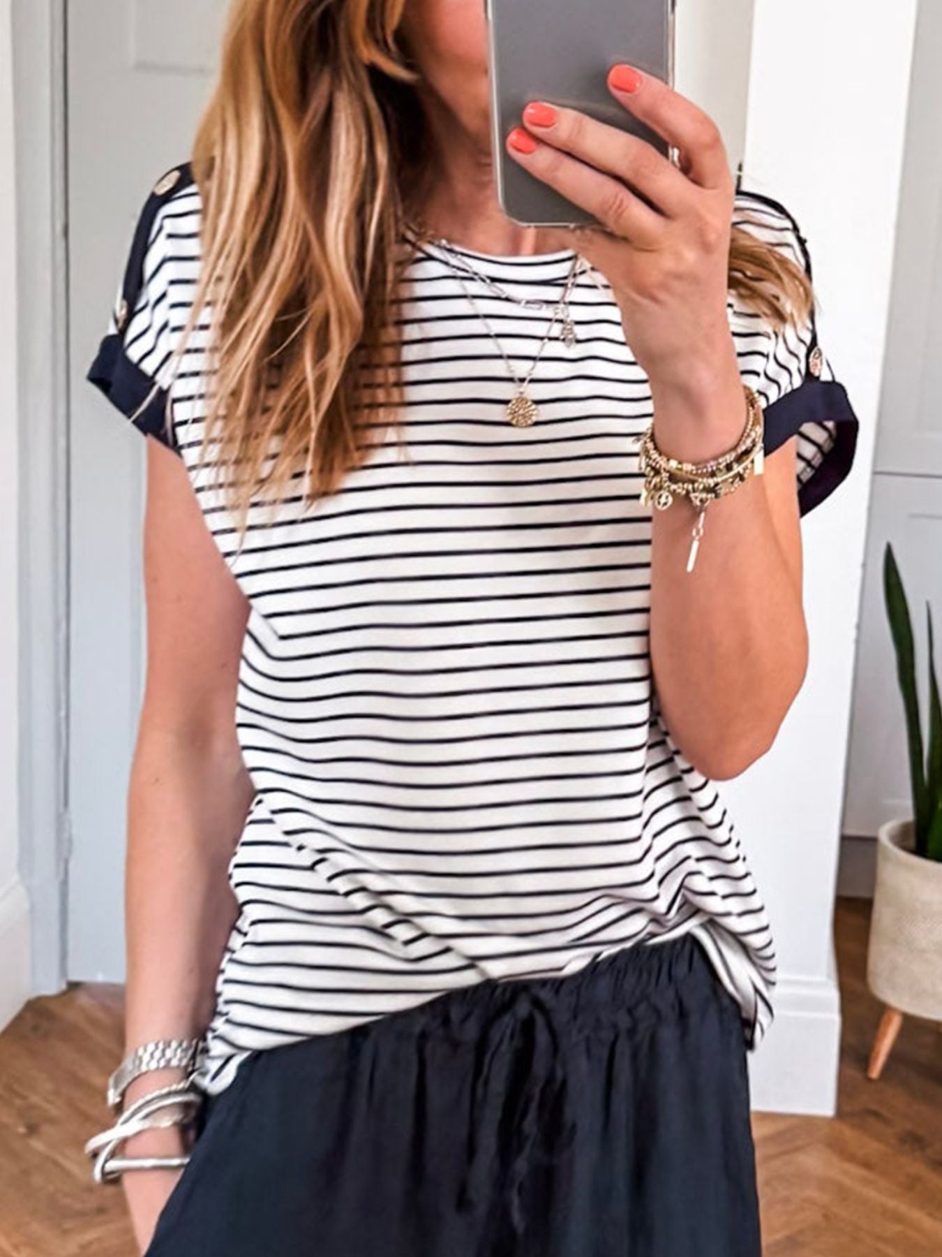 Black and white striped cotton blend t-shirt with cuffed sleeves and crew neck.