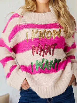 Bold sequin graphic colorblock knit sweater with crew neck and striped pattern.