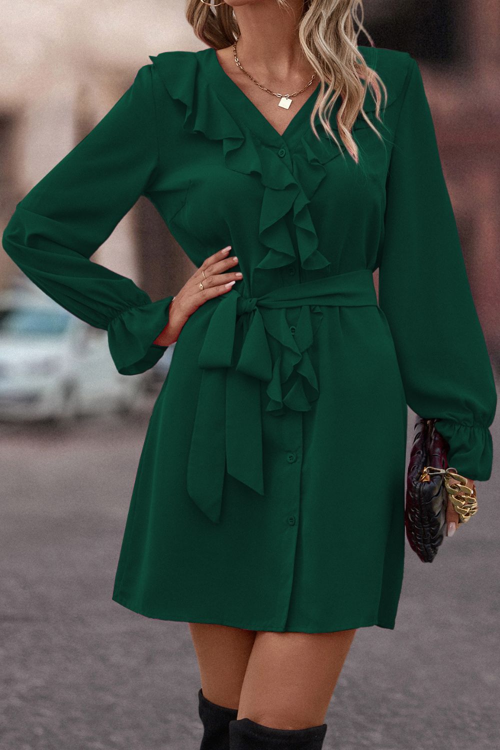 Green ruffled button-down A-line dress with belted waist and long sleeves.