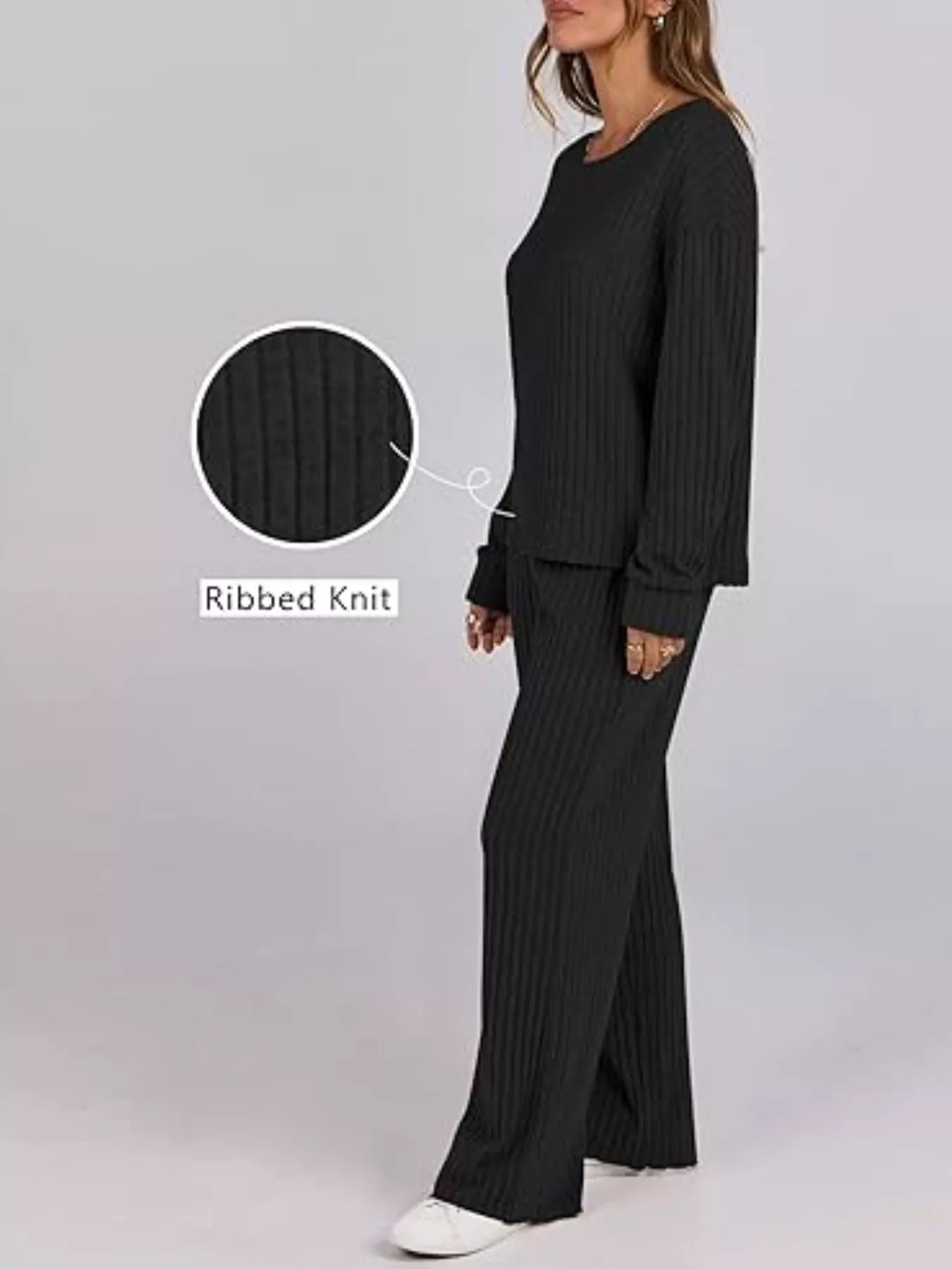 Black ribbed knit loungewear set with crew neck top and wide leg pants.