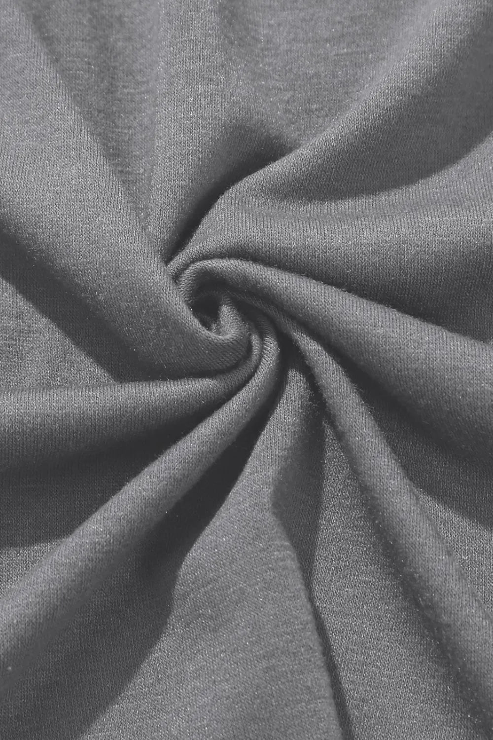 Gray wrap-front palazzo pants with slit hem, showing breathable fabric detail.