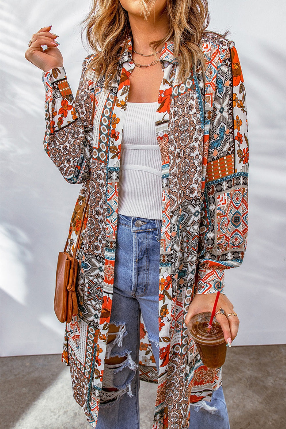 Patchwork print duster shirt jacket with button front and long sleeves.