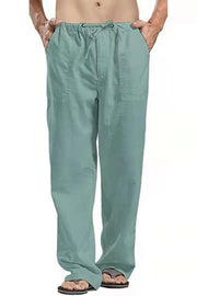 Men's relaxed fit linen drawstring trousers in Sage with side pockets.