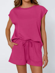Relaxed cap-sleeve tee and drawstring shorts set in Deep Rose, with side pockets.