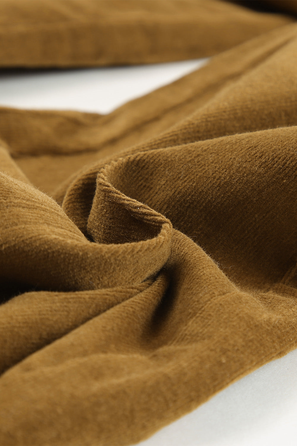 Seamed front wide leg trousers in caramel corduroy, showing texture detail.