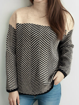 Chevron knit turtleneck sweater in black and tan with beige neckline.