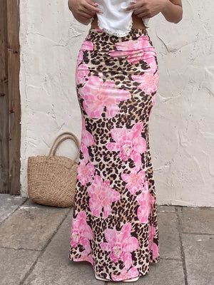 Leopard floral bodycon maxi skirt with pink flowers, high waist, and body-hugging fit.