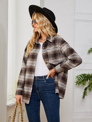 Brown plaid shacket with oversized button detail and collared neckline.