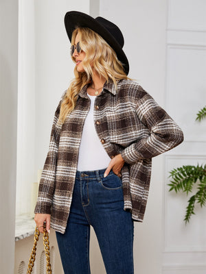 Brown plaid shacket with oversized button detail and collared neckline.