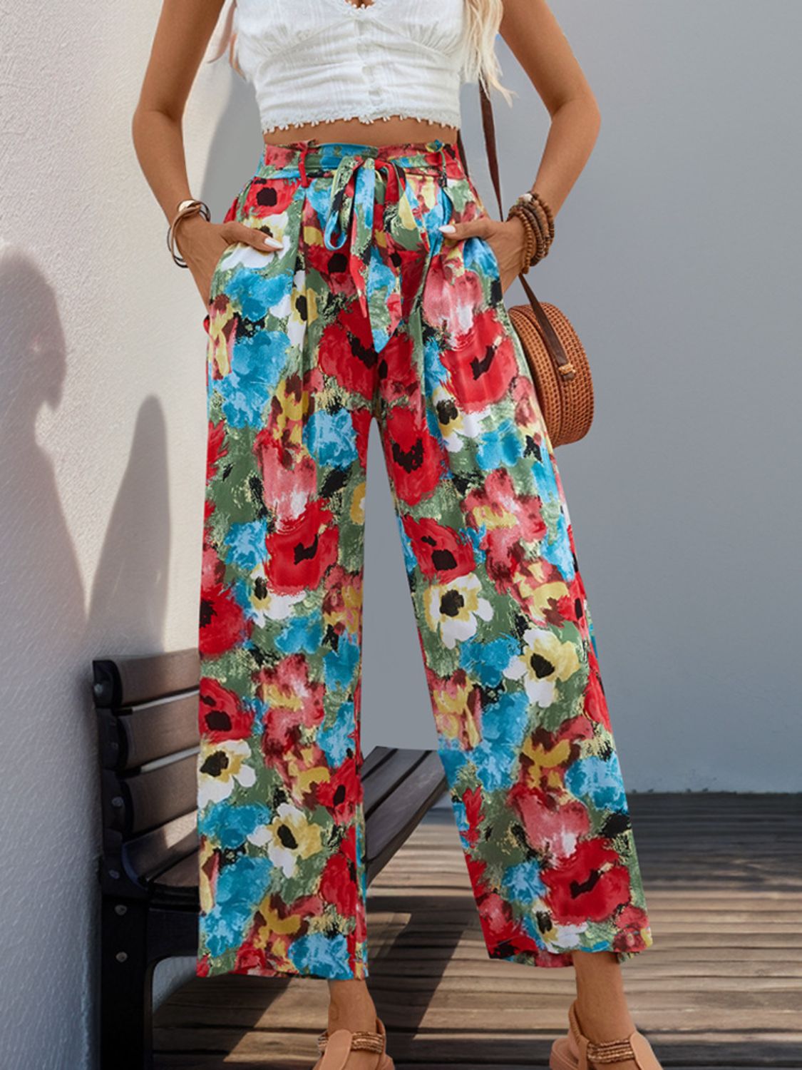 Painterly floral wide-leg trousers with a tie waist and pockets in multicolor.