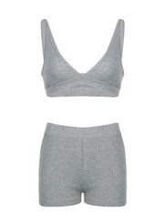 Grey ribbed knit bralette and shorts set with V-neckline and elastic waistband.
