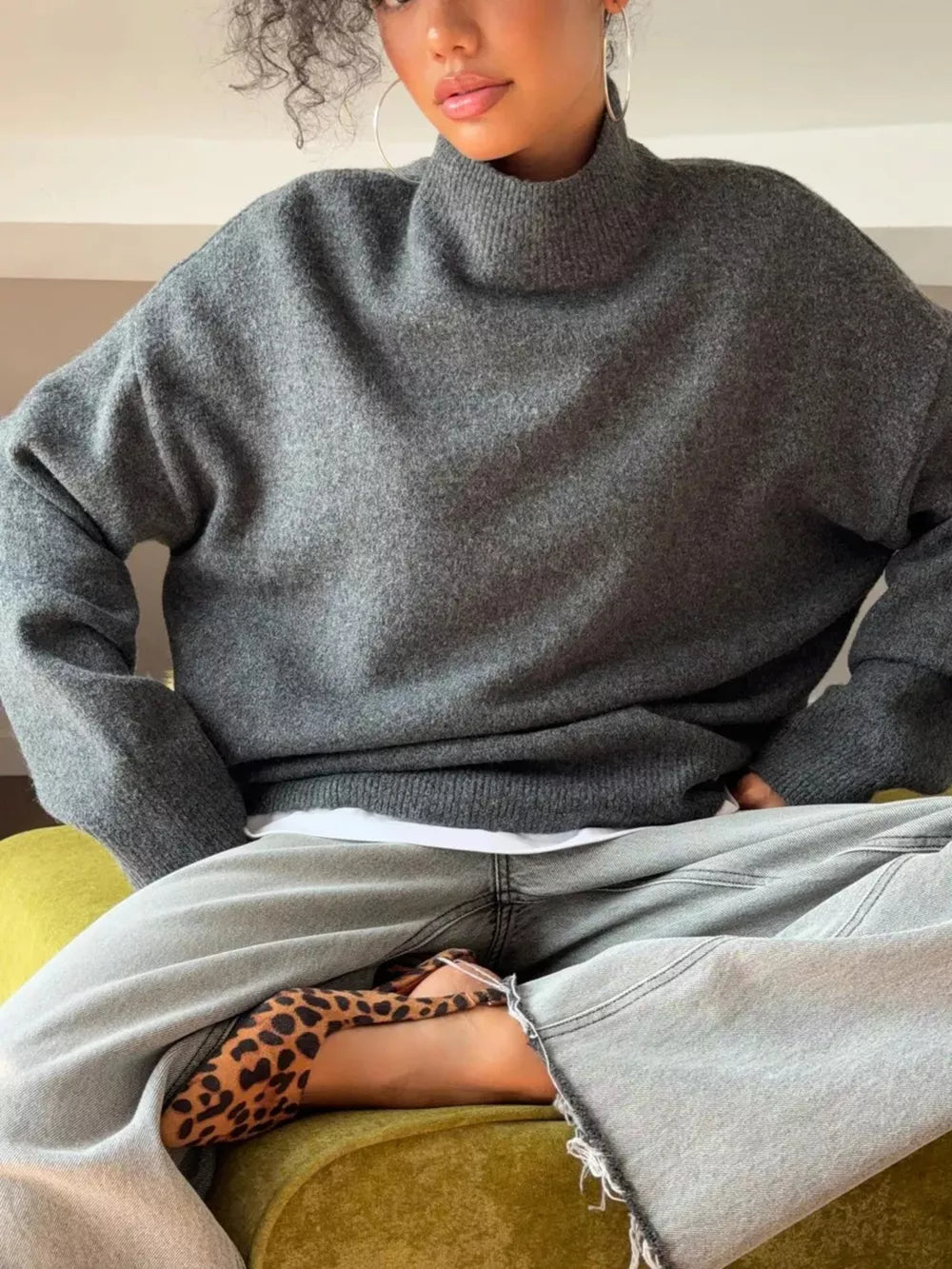 Relaxed mock neck knit sweater in dark gray acrylic blend with a comfortable, casual fit.