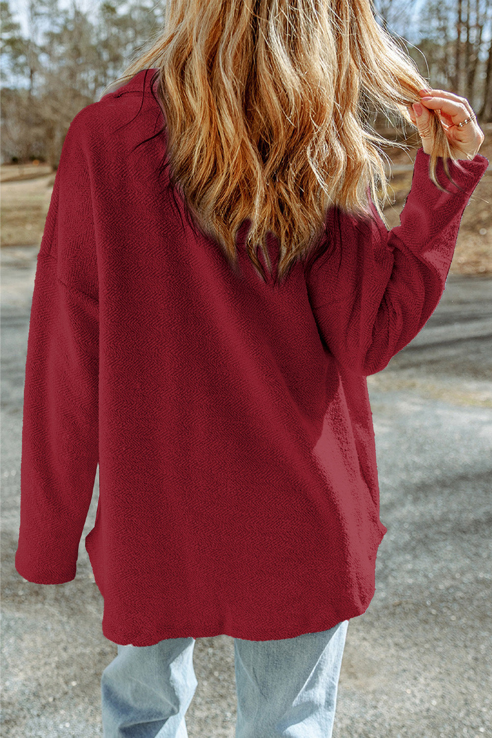 Burgundy textured shacket with raw-edge detailing and pockets.