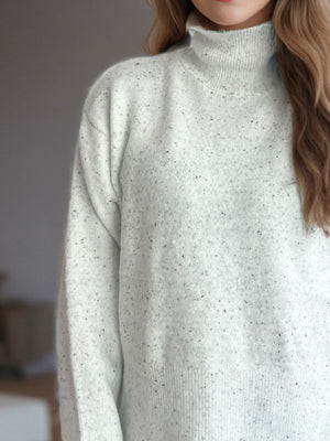 Ribbed hemline slit-side turtleneck knit sweater in camel, white, scarlet, or black acrylic.