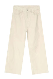 Oversized beige denim jeans with a sculpted leg and neutral wash.