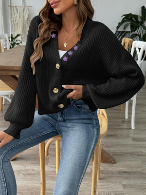 Black balloon sleeve cardigan with floral embellishments and button front.