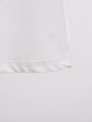 White midi dress detail showing hem and stitching