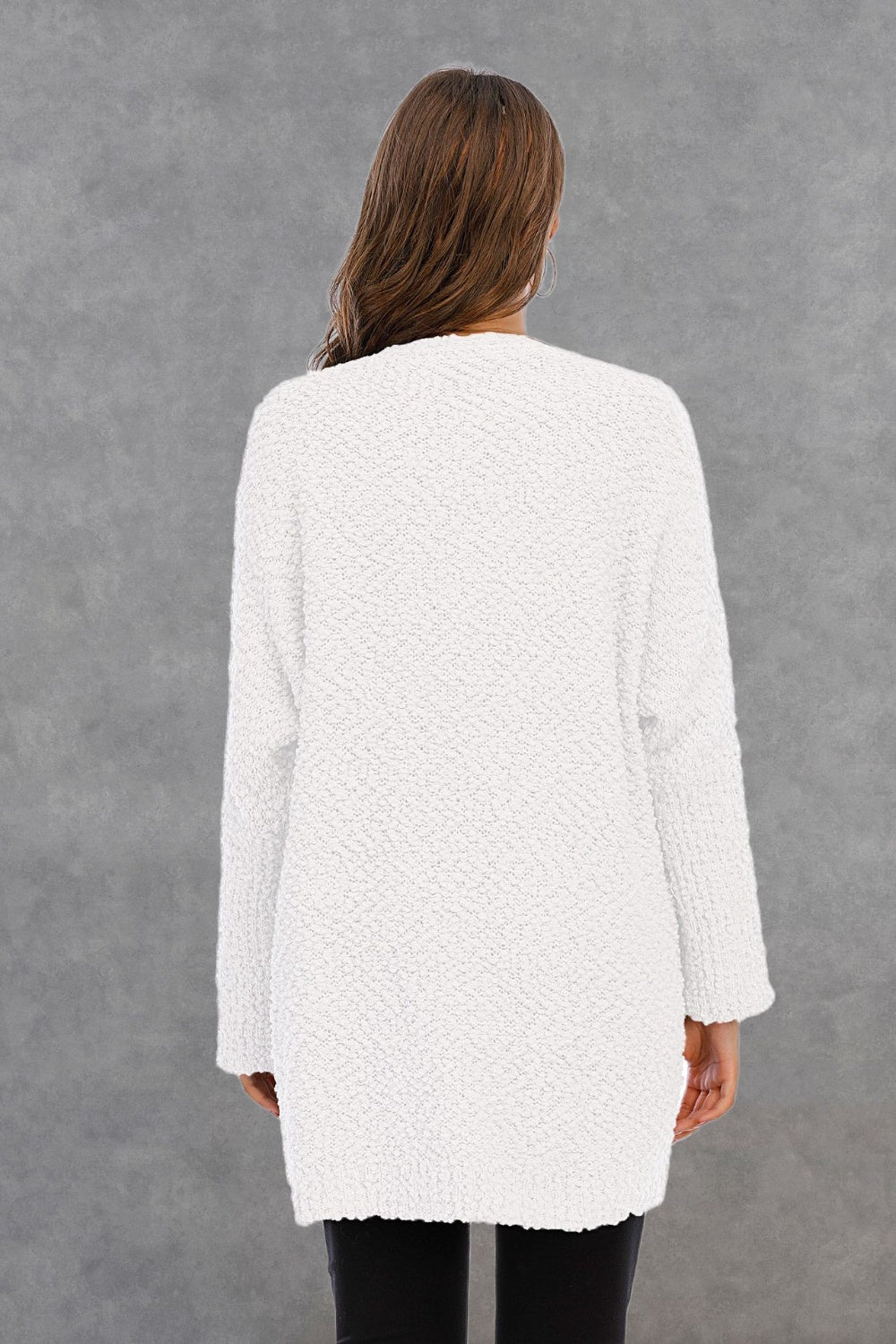 White textured cocoon cardigan with long sleeves and a relaxed fit.
