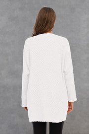 White textured cocoon cardigan with long sleeves and a relaxed fit.