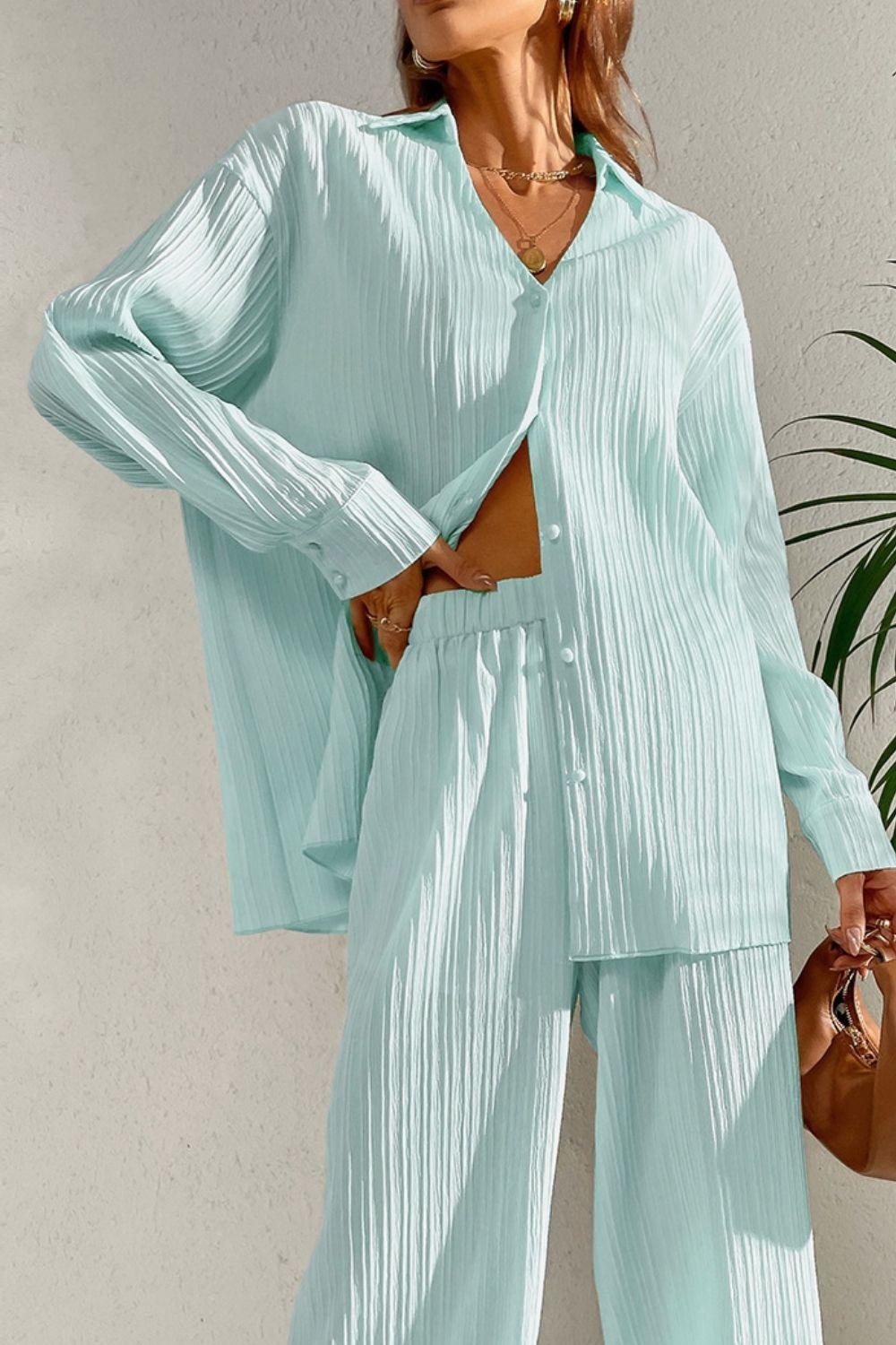 Pastel blue pleated co-ord set with button-down shirt and wide leg trousers