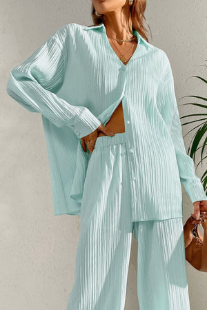 Pastel blue pleated co-ord set with button-down shirt and wide leg trousers