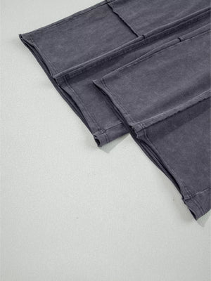 Maternity cropped wide-leg pants in charcoal cotton with visible seams and a washed finish.