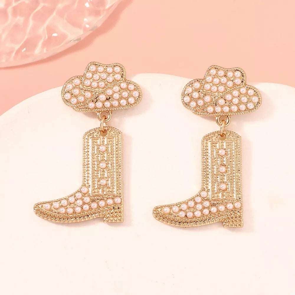 Gold cowboy boot dangle earrings with pearl accents and cloud tops.