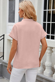 Textured watermelon pink blouse with rolled sleeves and V-neck