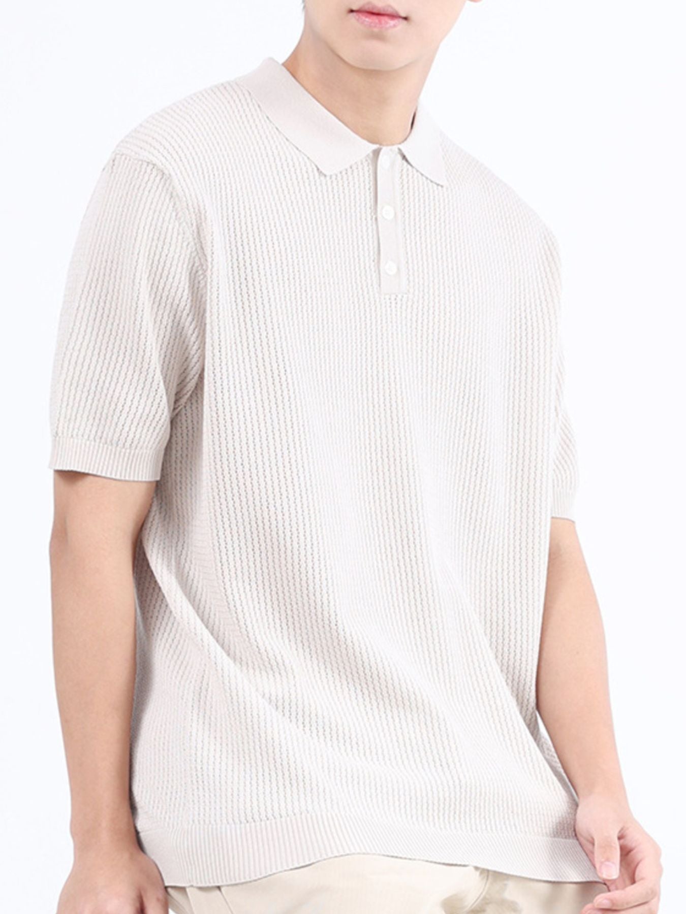 Beige textured knit polo shirt with classic collar and short sleeves.
