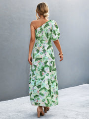 Light green tropical print one-shoulder maxi dress with balloon sleeves and tiered skirt.