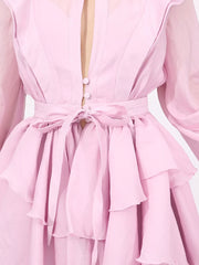 Pink tiered ruffle mini dress with button front and tie waist.