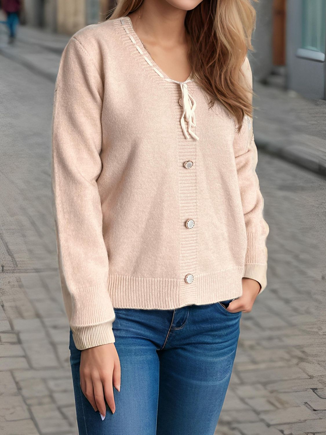 Ribbon-trimmed button-front knit cardigan in light pink with tie neck detail.