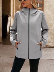 Gray zip-through hooded jacket with zippered pockets and elastic cuffs.