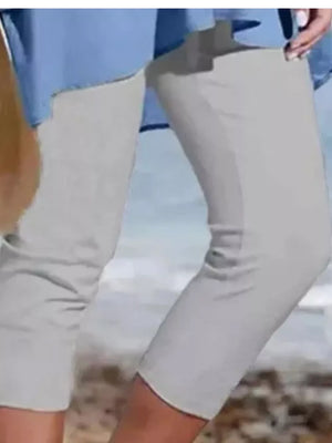 Light gray cropped leggings with a casual fit, hitting just above the knee.