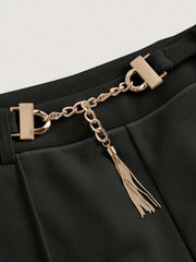 Black flared leg trousers with gold chain detail and tassel accent.