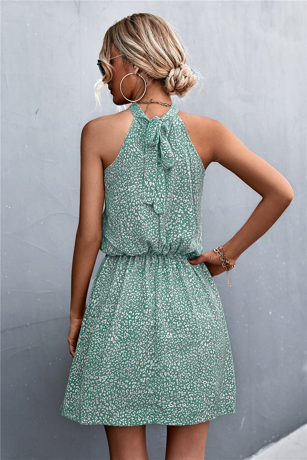 Yellow Green floral halter neck mini dress with tie back and elastic waist
