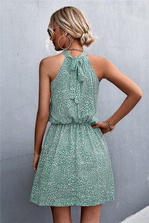 Yellow Green floral halter neck mini dress with tie back and elastic waist
