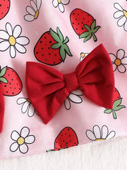Pink strawberry print baby dress with red bow detail